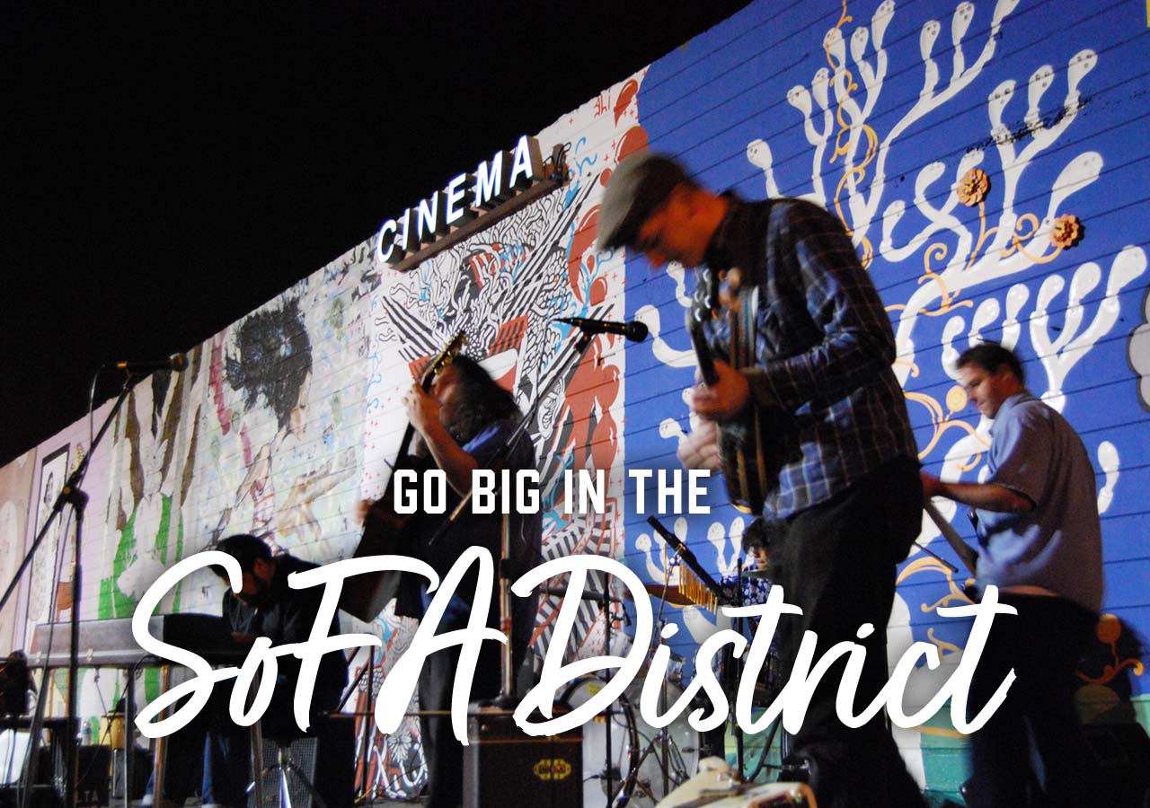 A live band playing a show. A headline reads: Go Big in the SoFA District!